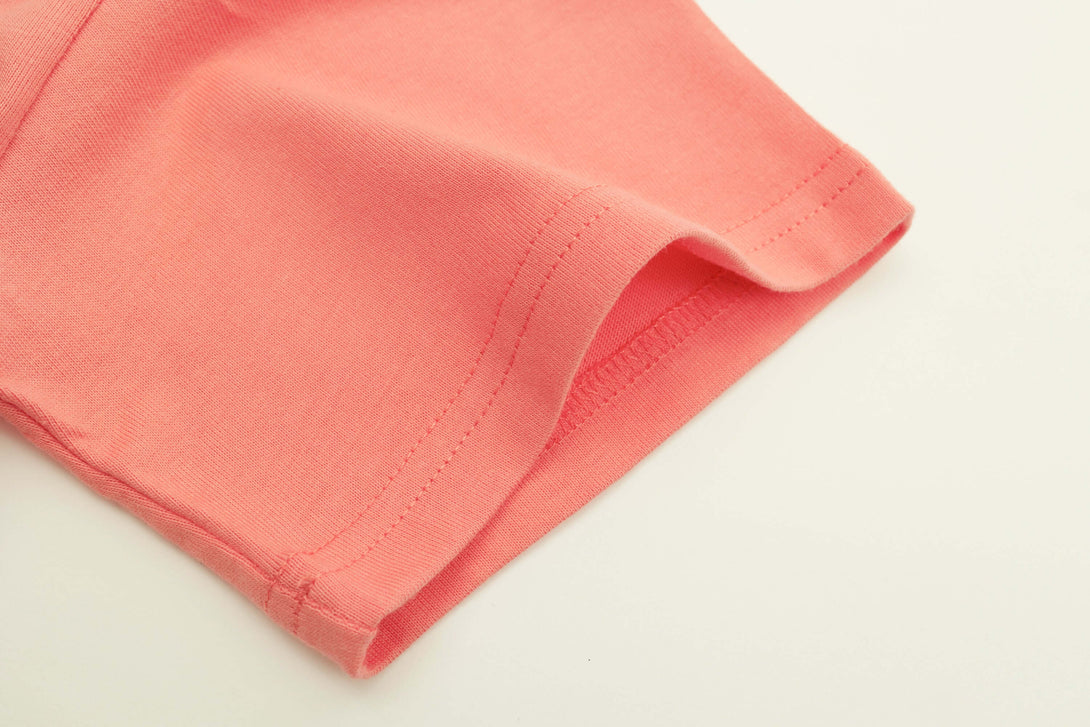 Double-stitched sleeve cuff detail on kids tee