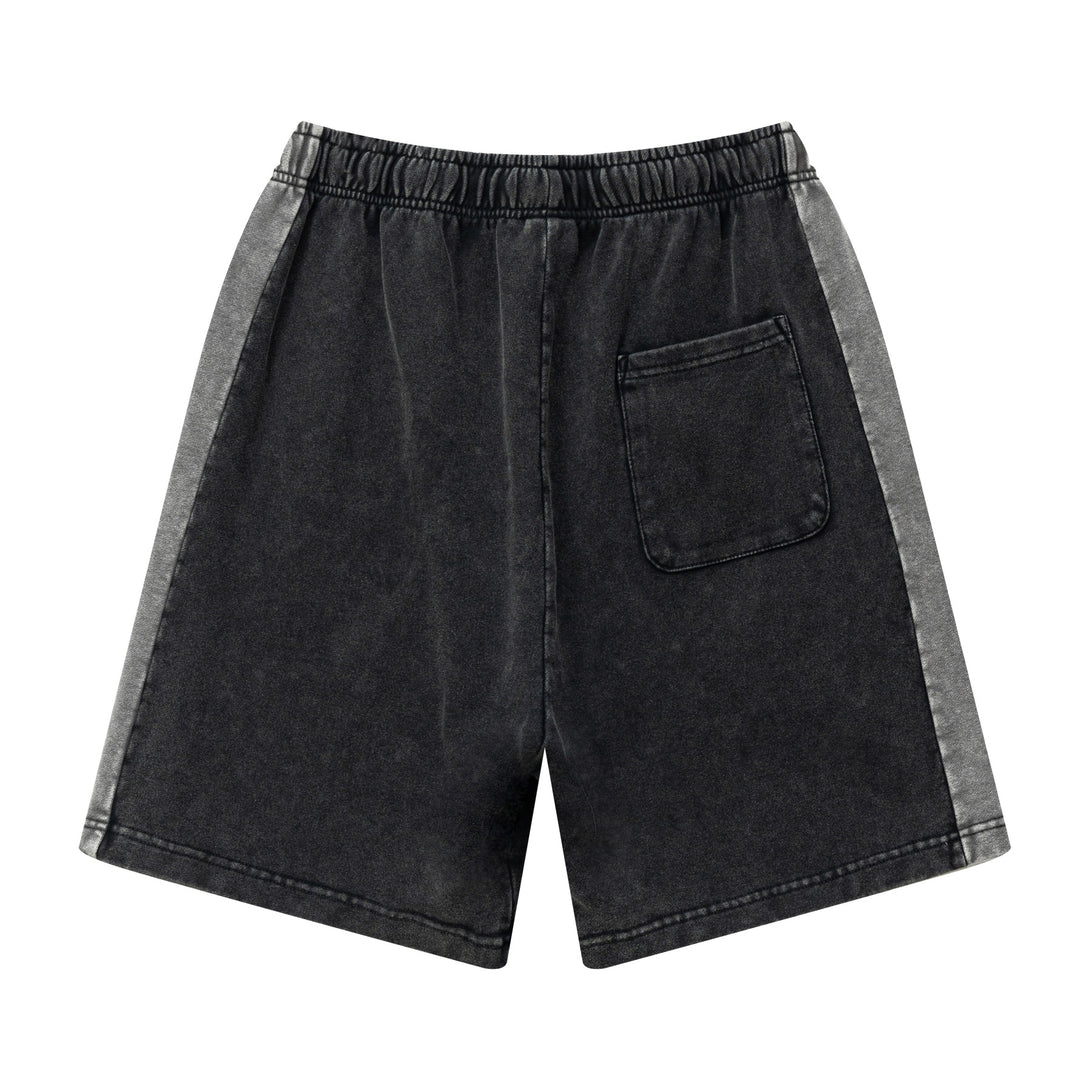 Back view of heavy wash unisex retro shorts in Black/Dark Gray colorblock