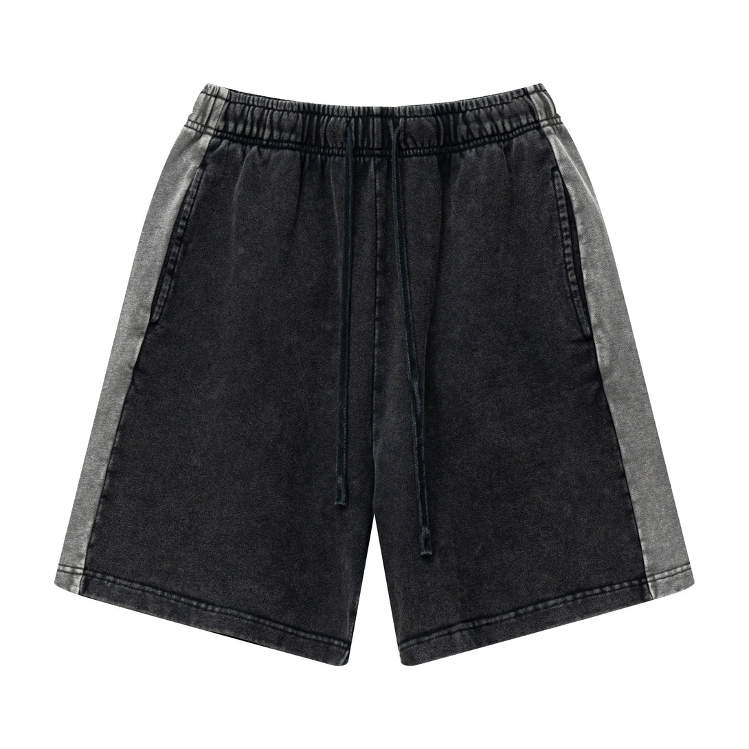 Front view of heavy wash unisex retro shorts in Black/Dark Gray colorblock
