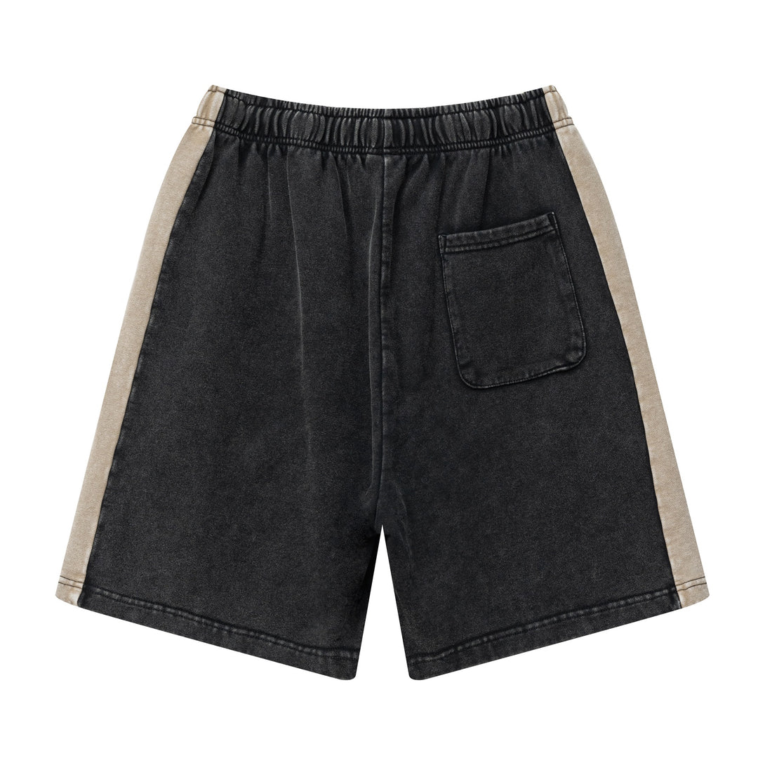 Back view of heavy wash unisex retro shorts in Black/Khaki colorblock