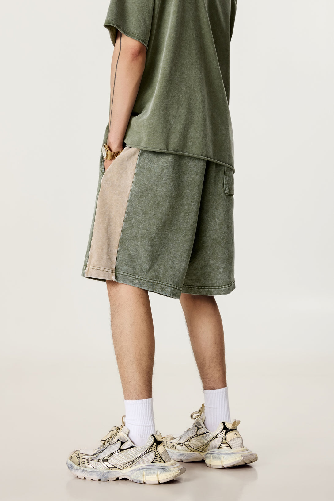 Model wearing unisex retro shorts, back view