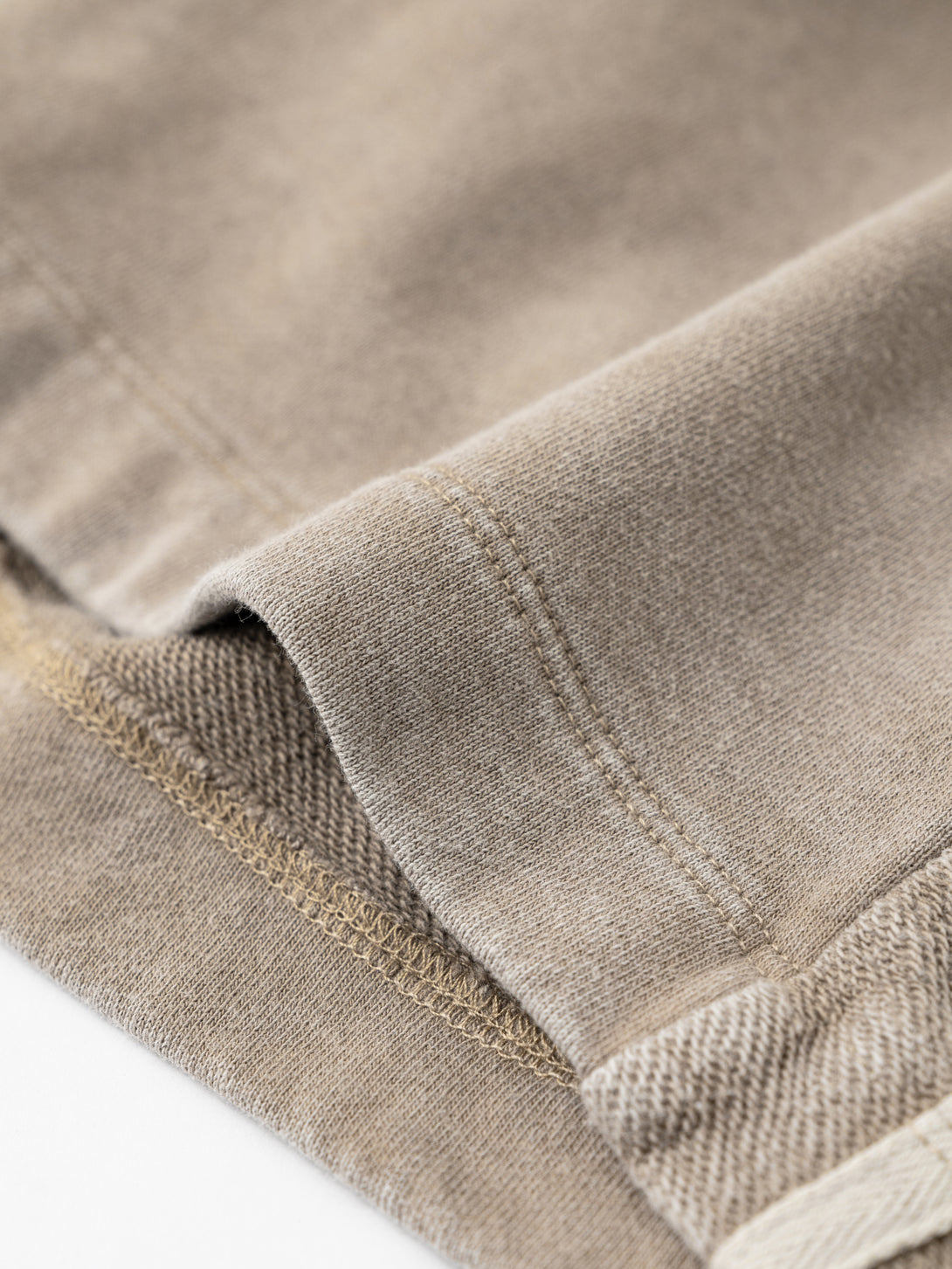 Raw hem finish with snow wash fading
