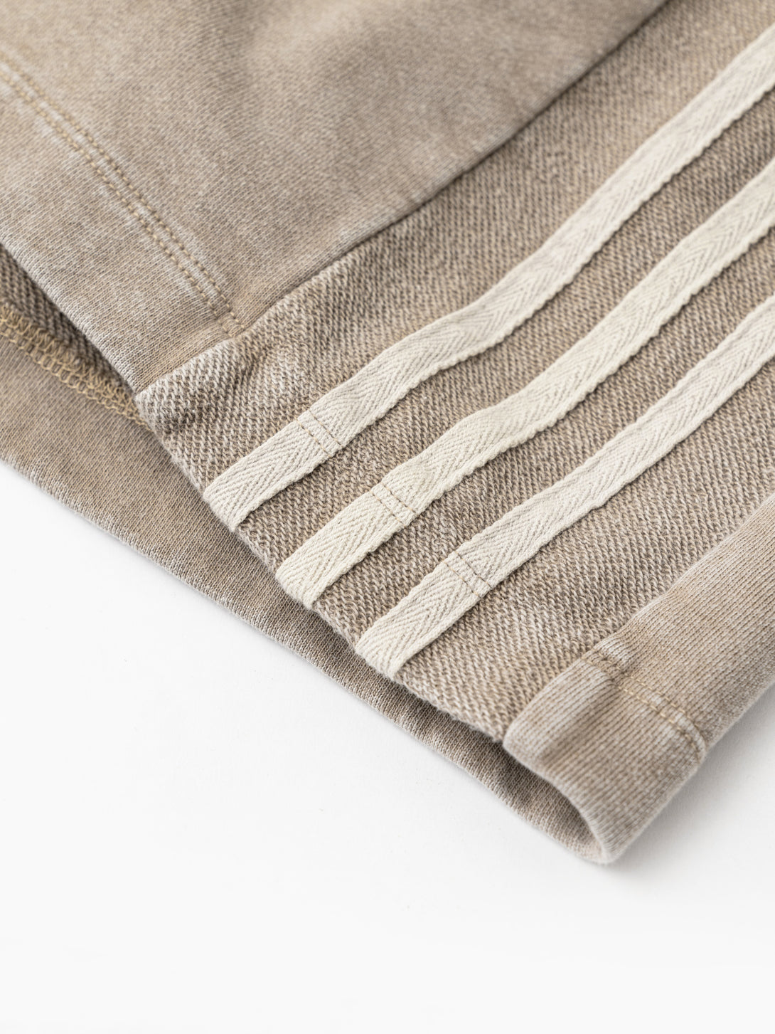 Triple contrast stripes at side hem detail