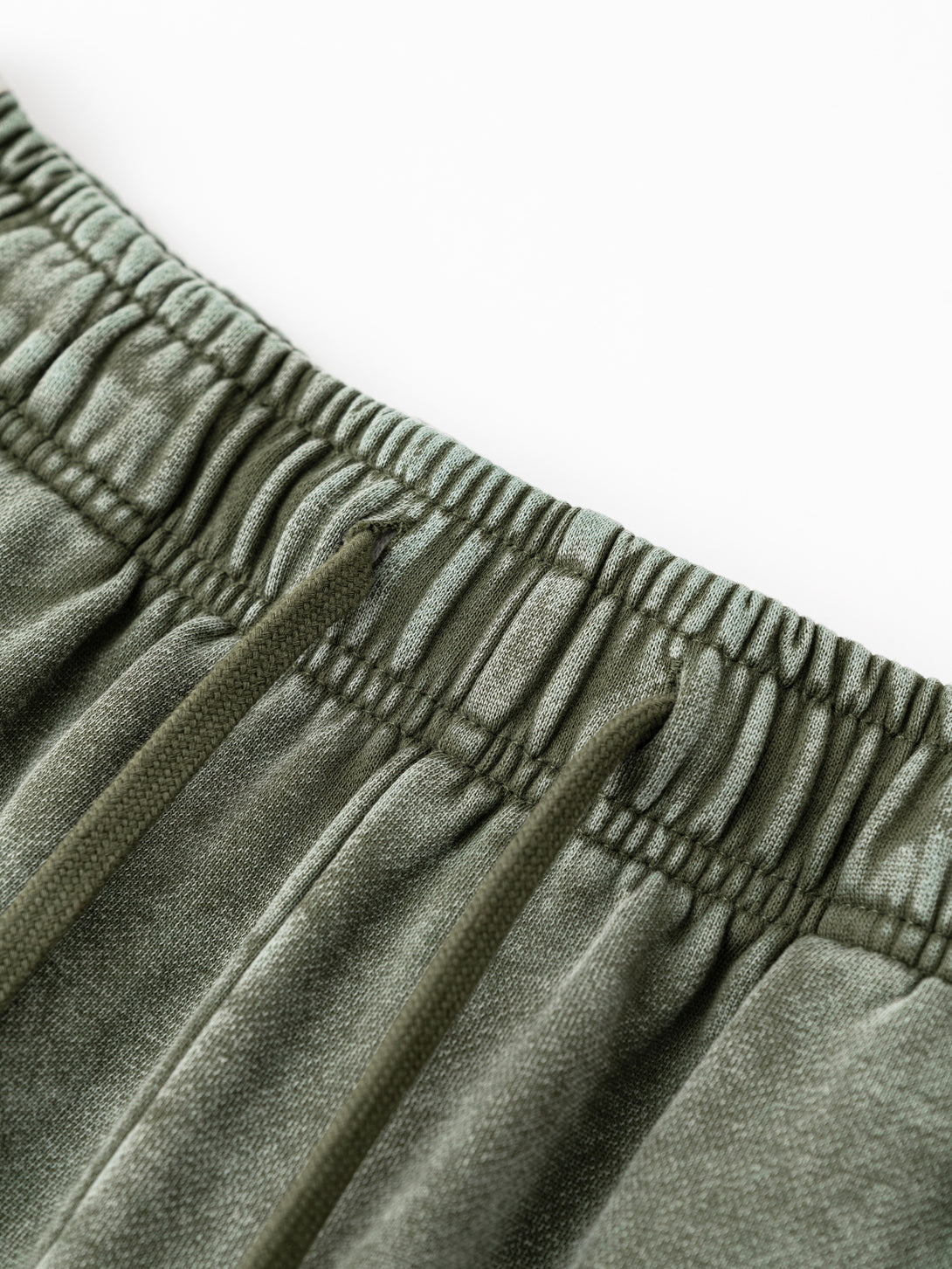Close-up of drawstring waistband with contrast woven tape