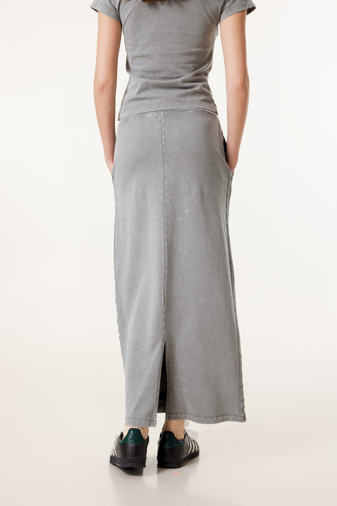 Back view of model in heavy wash straight A-line skirt
