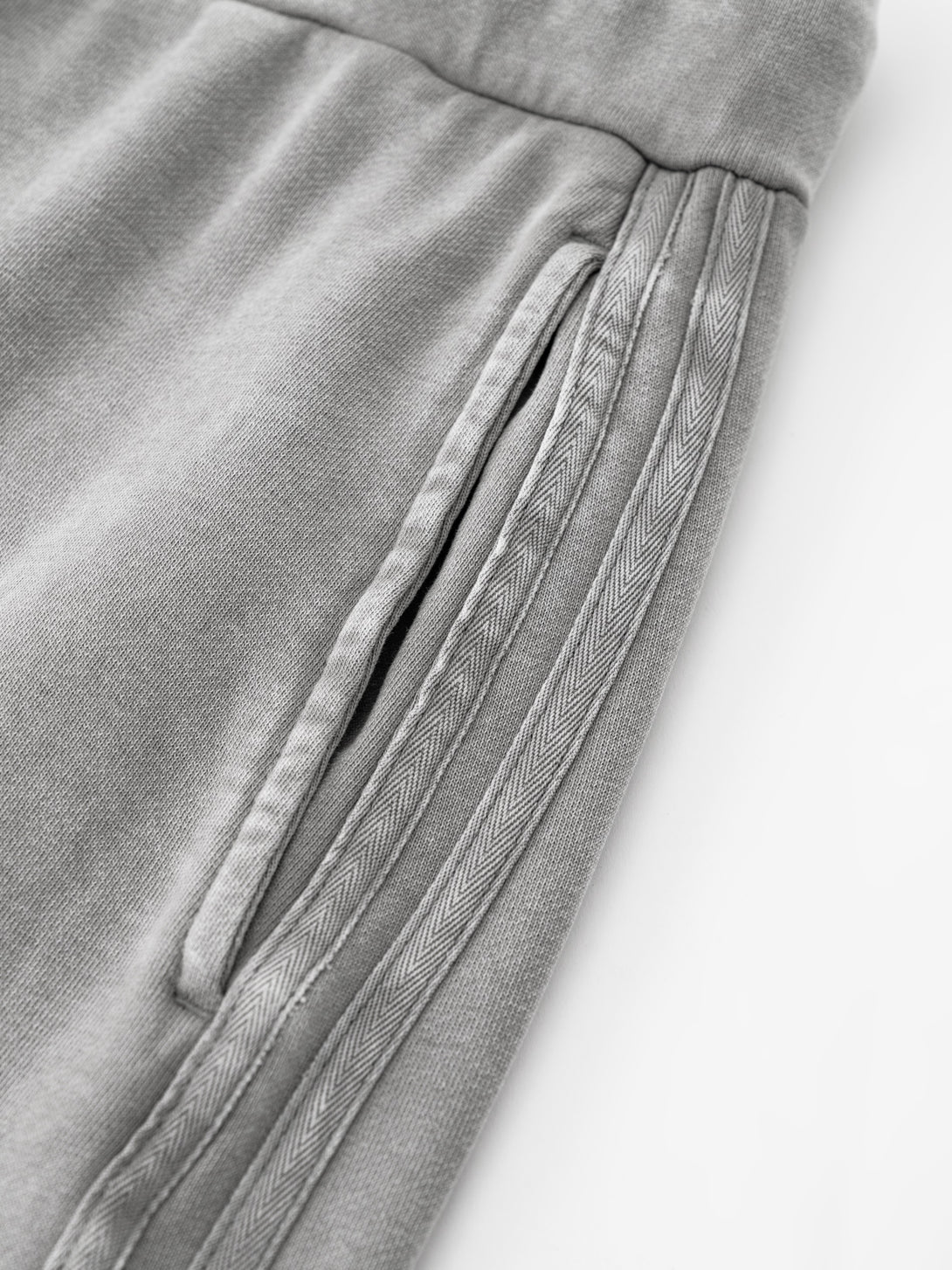 Detail of double-stitched pocket hem on women's skirt