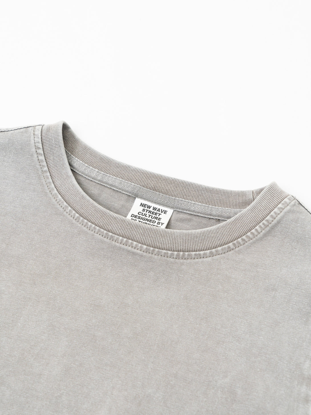 Close-up detail of reinforced ribbed collar on women's heavy wash t-shirt