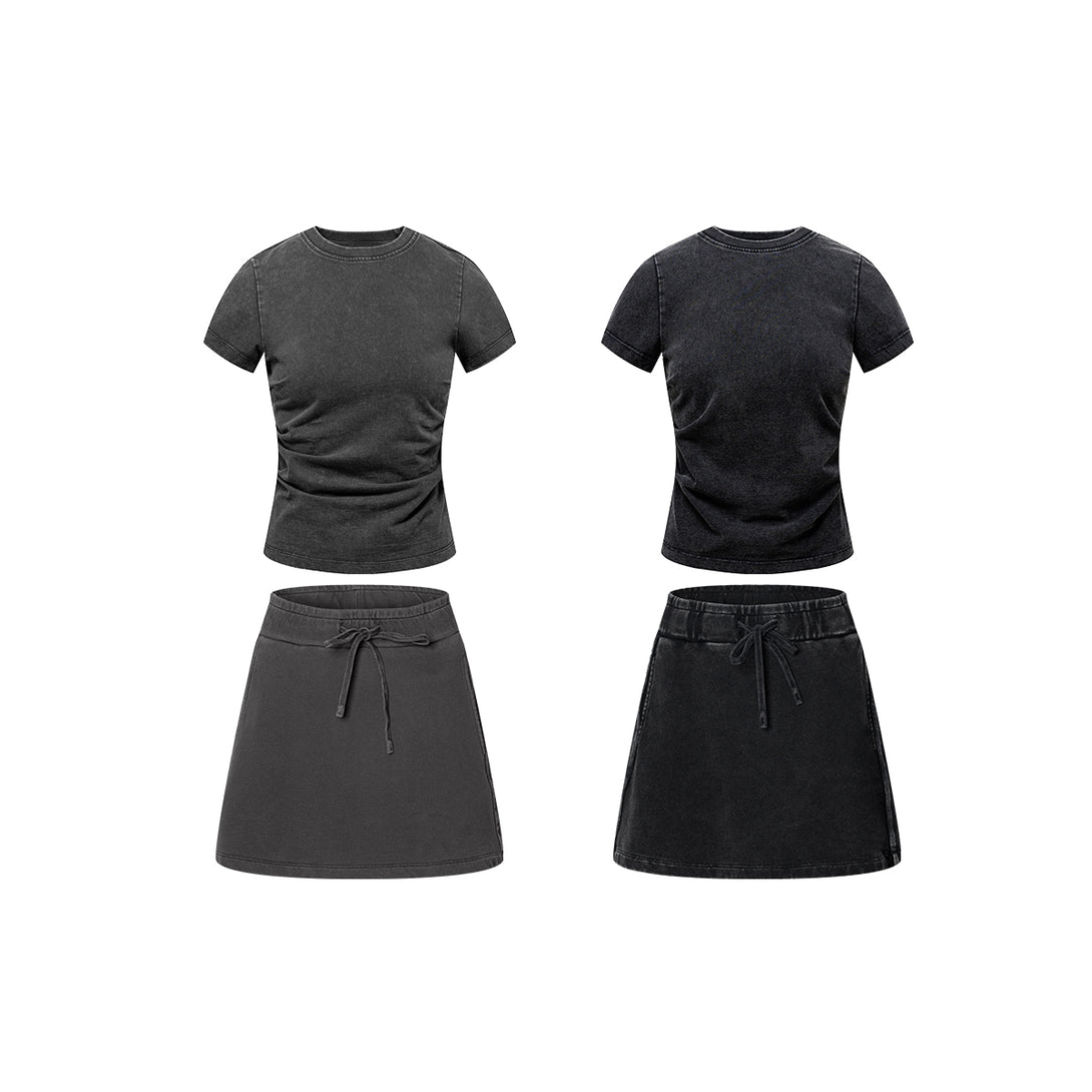 Women's heavy wash t-shirt paired with short skirt outfit