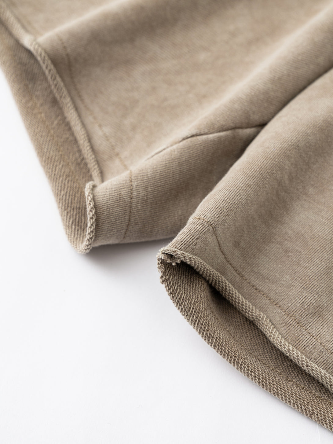 Close-up of rolled cuff hem finish