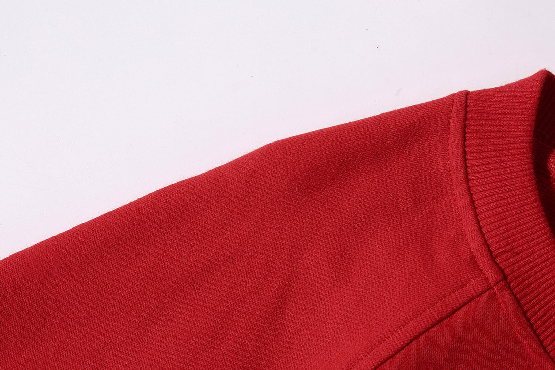 Double-stitched shoulder construction detail on fleece sweatshirt