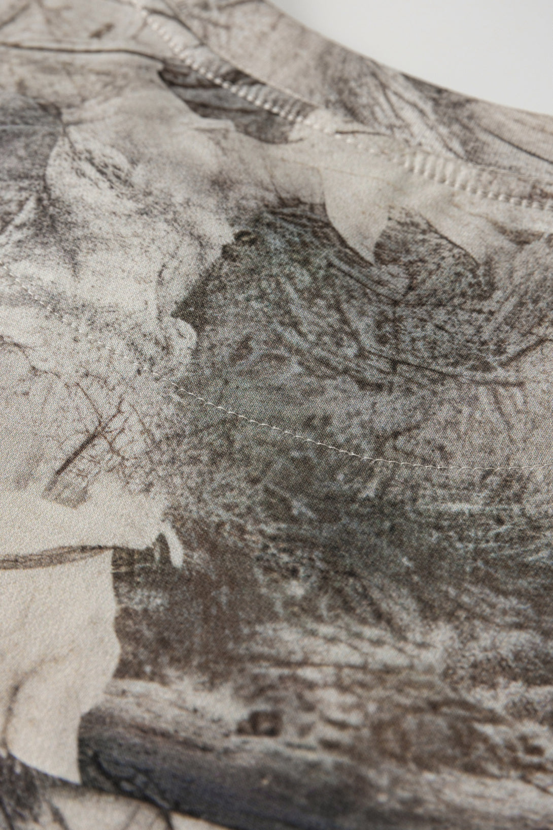 Men's 240g Camouflage All Over Print T-Shirt fabric close-up showing detailed texture and design.