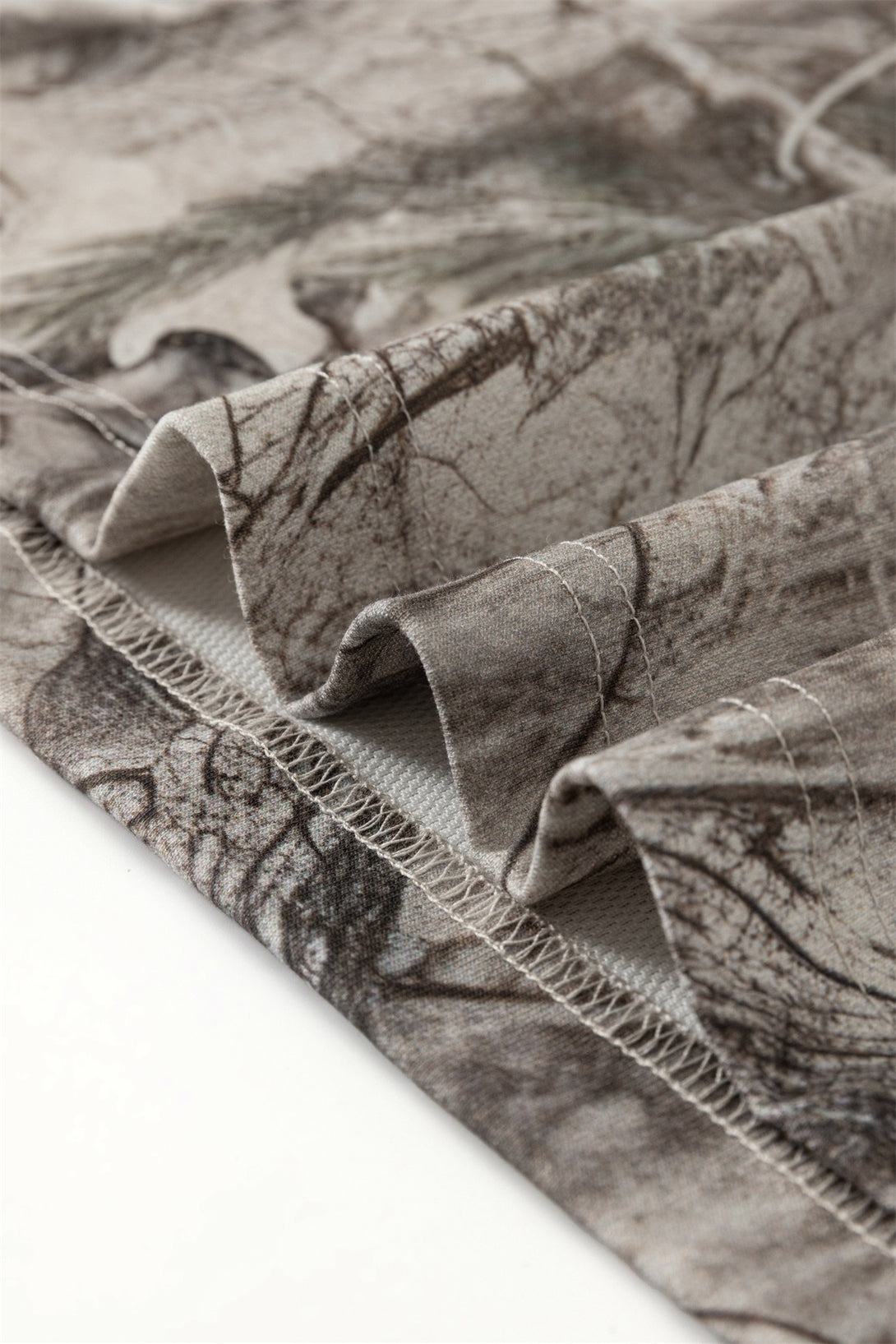 Close-up of Men's 240g Camouflage All Over Print T-Shirt fabric showing detailed pattern and stitching.
