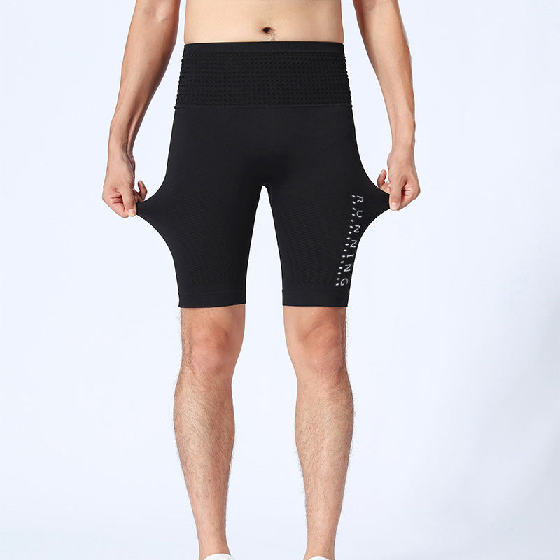 Male model showcasing front fit in black shorts