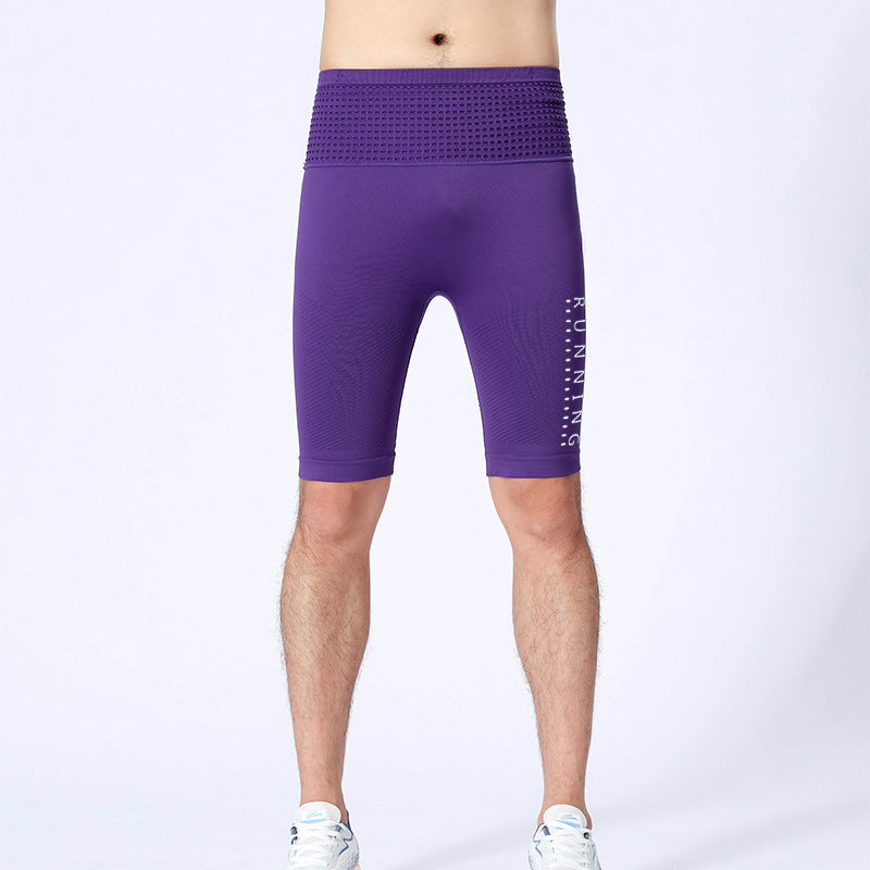 Jumping motion in purple men's compression sportswear