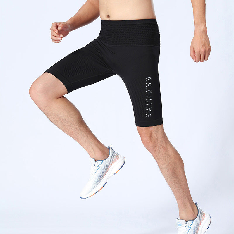 Runner in black compression shorts during training