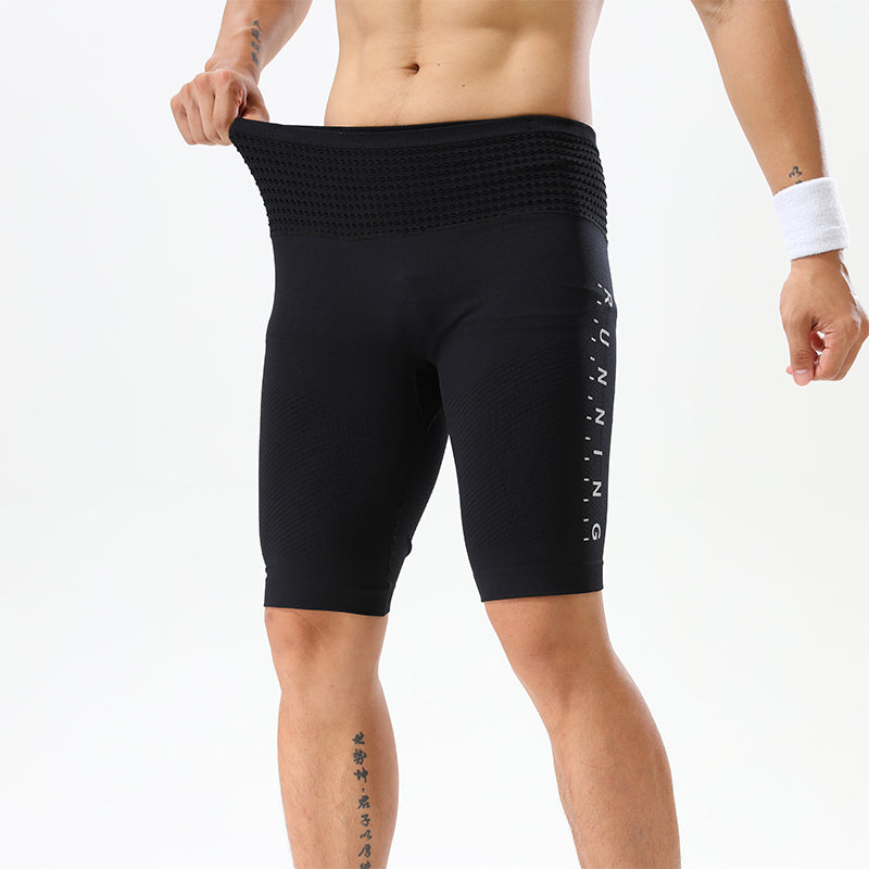 Squat position in high-elasticity black training shorts