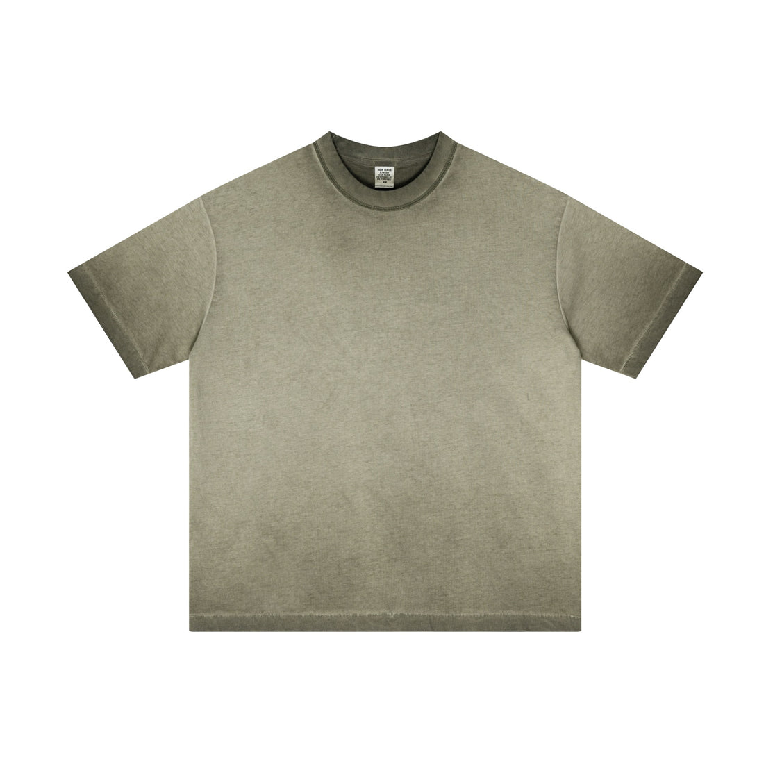 Army green cotton oversized t-shirt with raw-edge hem and reverse-distressed effect, front view. Unisex streetwear wholesale.