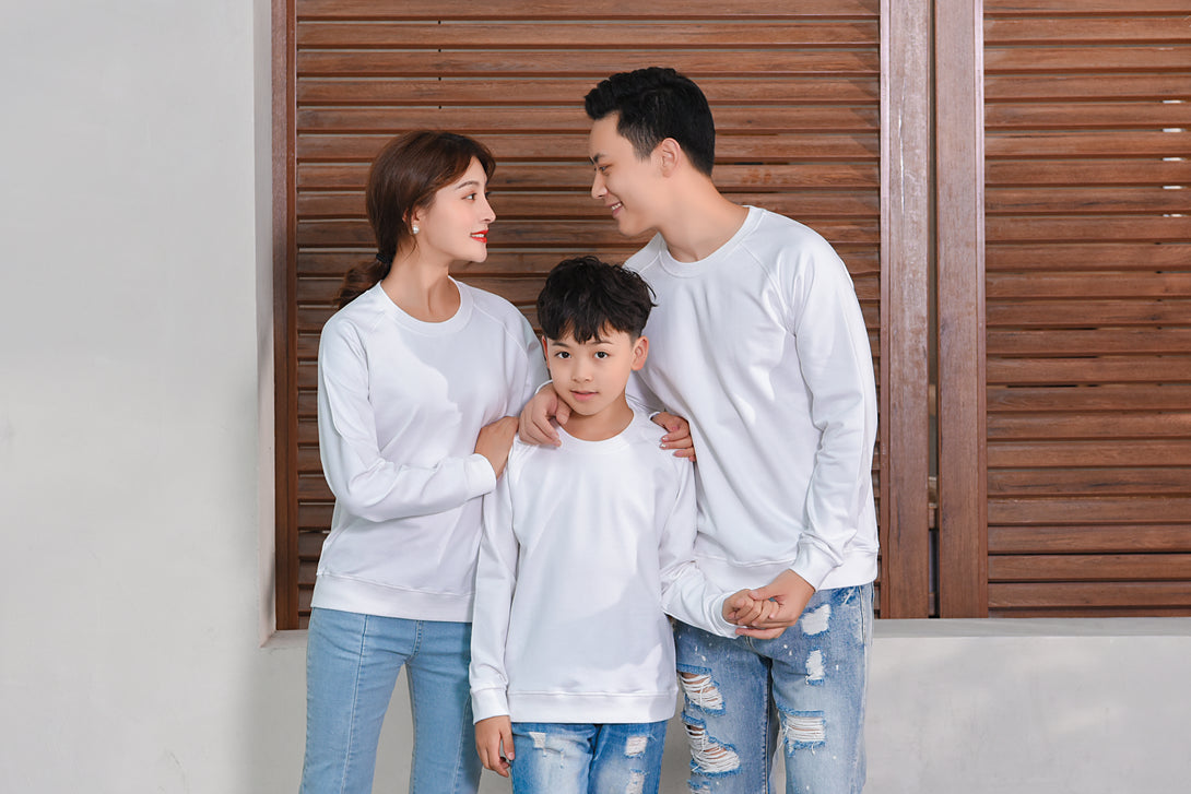 Parent and child modeling front view in matching black sweatshirts