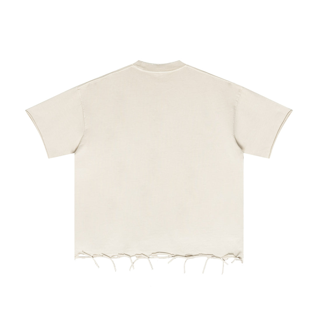 Back view of Apricot pigment-dyed tee showcasing raw-edge hem trim for bulk garment manufacturing.
