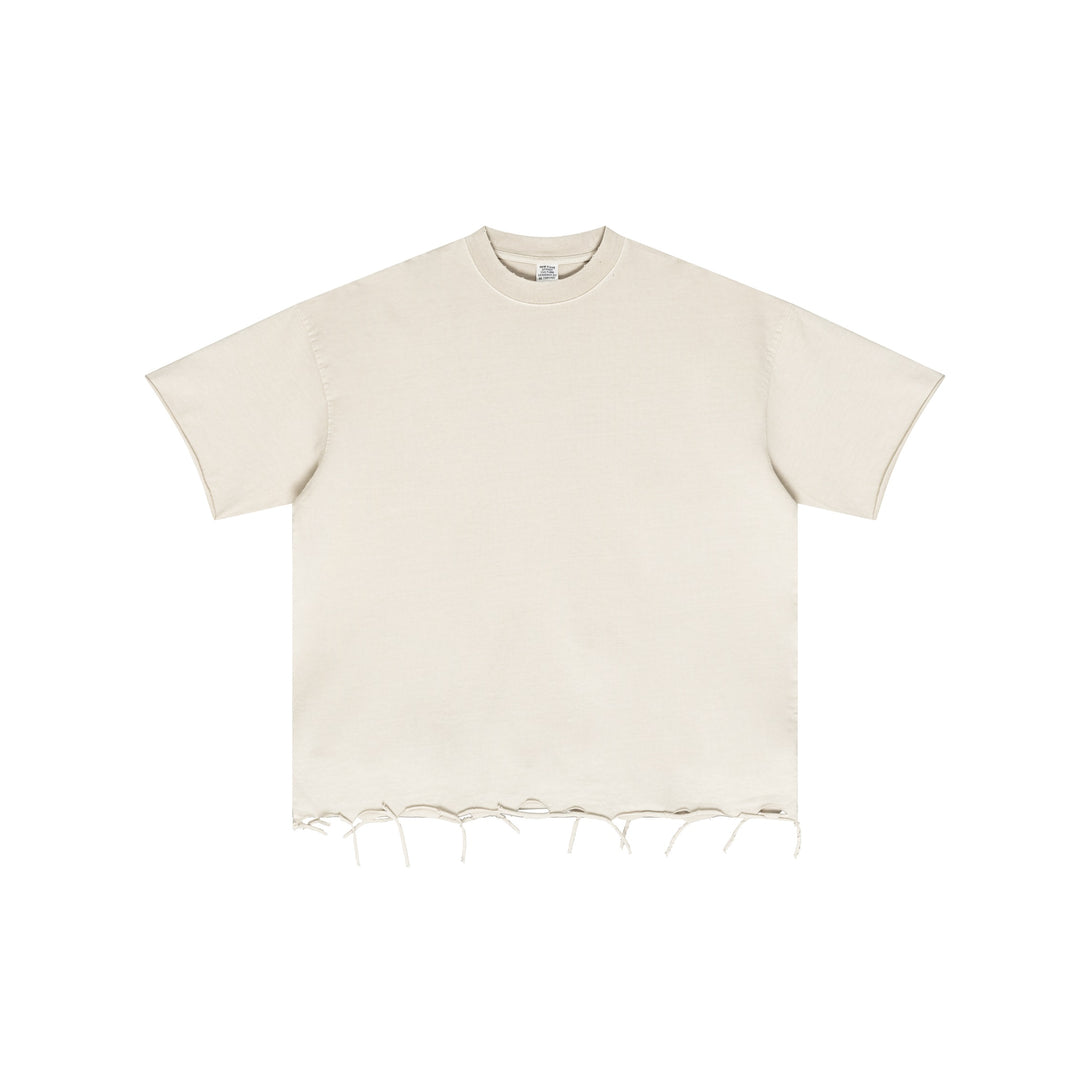 Front view of Apricot Oversized Cotton Tee with pigment dye technique and raw-edge distressed trim, wholesale streetwear essential.