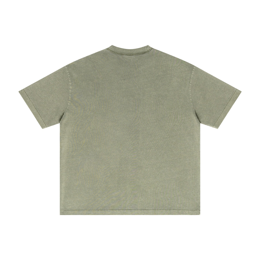 Army green oversized tee back featuring SS25 vintage wash and pigment-dyed texture. Wholesale streetwear supplier item.