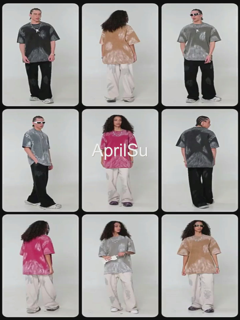 Manufacturing showcase of hand-brushed pigment-dye oversized cotton tee. Model demonstrates fit and texture for bulk wholesale orders.