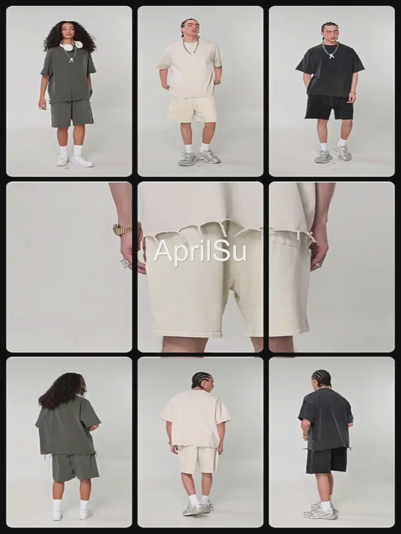 Professional model showcasing Pigment Dye Oversized Cotton Tee with raw-edge distressed trim, demonstrating garment movement and streetwear fit for wholesale buyers.