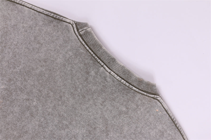 Back rib collar construction detail of round-neck distressed washed vintage sweatshirt