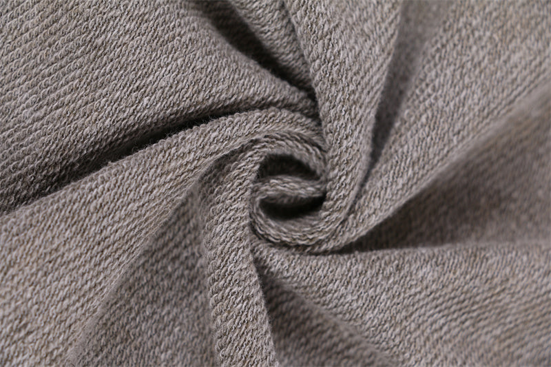 Fabric texture showing 60% cotton 40% polyester blend on round-neck distressed washed vintage sweatshirt