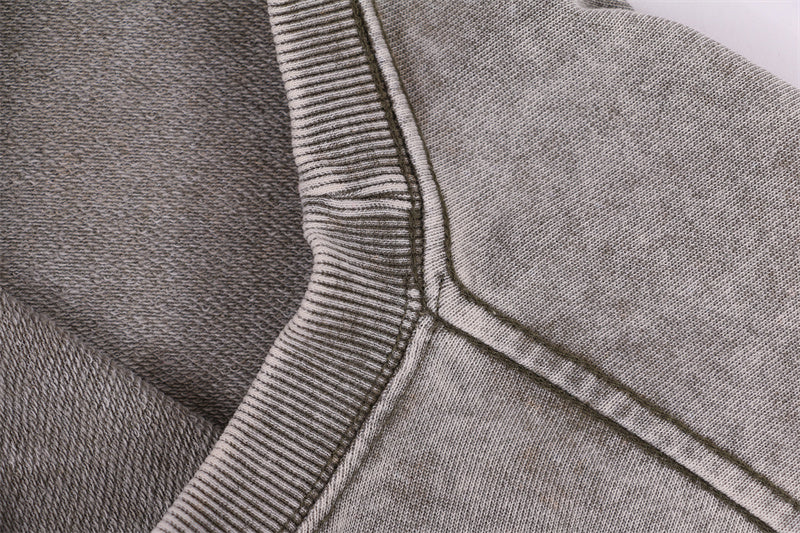 Front shoulder seam reinforcement on round-neck distressed washed vintage sweatshirt