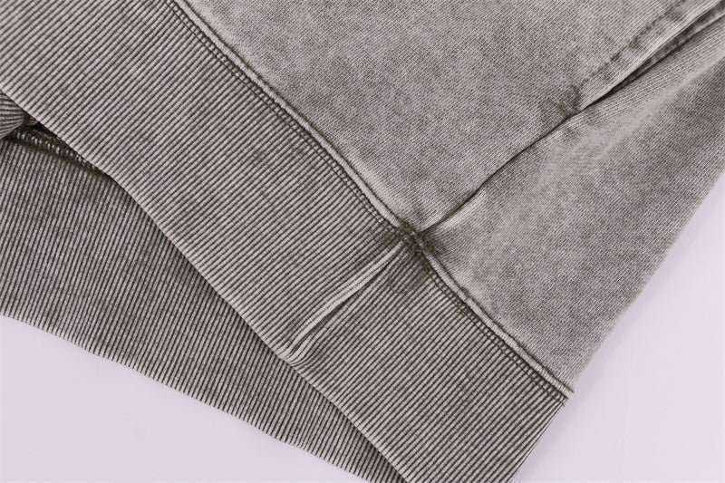 Hem stitching detail on round-neck distressed washed vintage sweatshirt