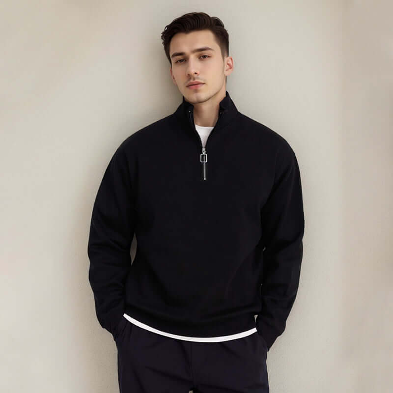 Semi Zip Sweatshirt in black with stand collar and semi-zip closure, worn by a male model.
