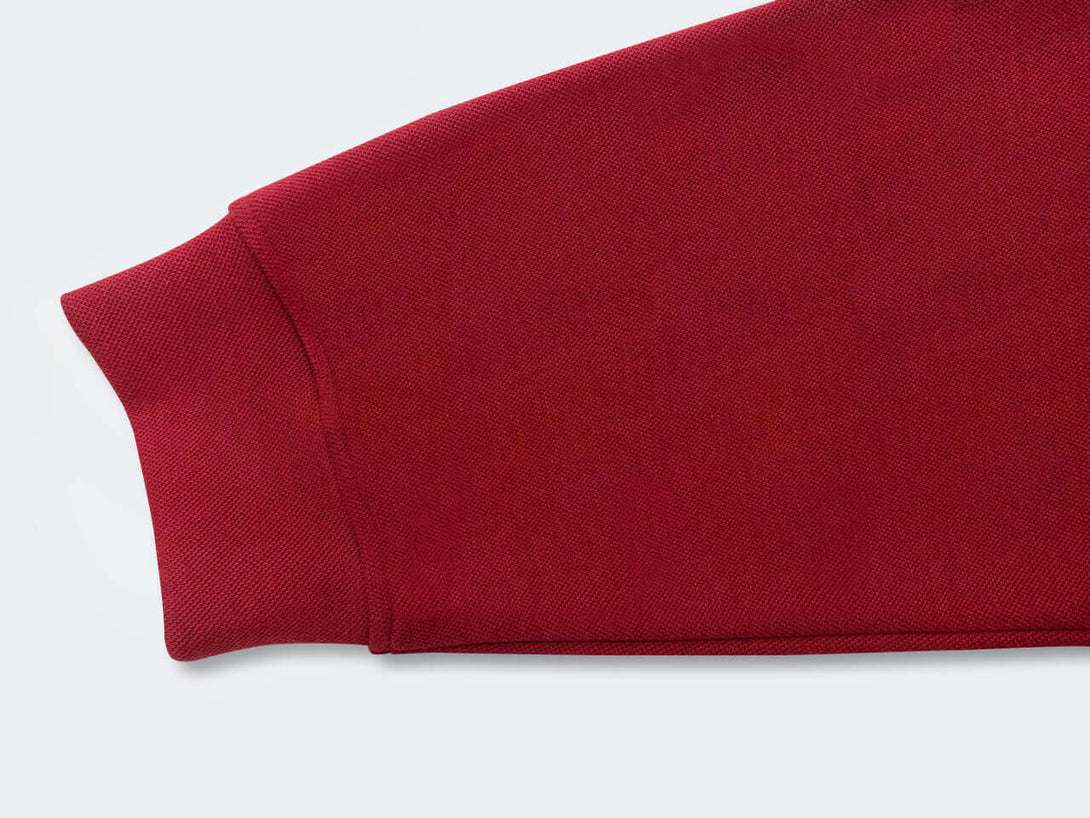 Semi Zip Sweatshirt sleeve detail showcasing rich red color and comfortable fabric.