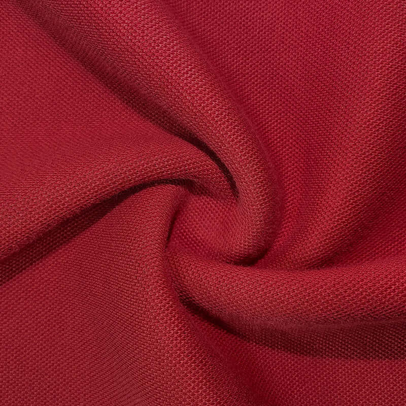 Close-up of textured red fabric showcasing the material used in the Semi Zip Sweatshirt.