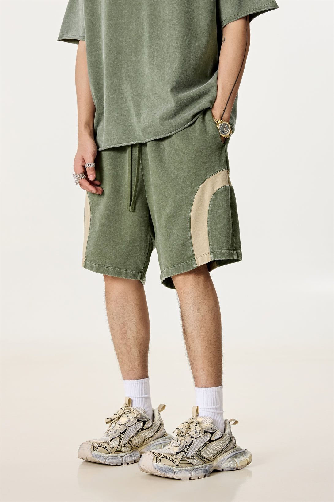Model wearing straight-fit colorblock shorts, front view