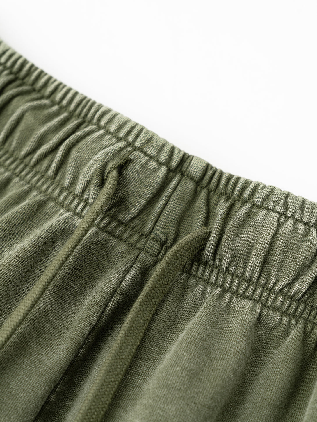 Close-up of drawstring waistband with snow wash effect