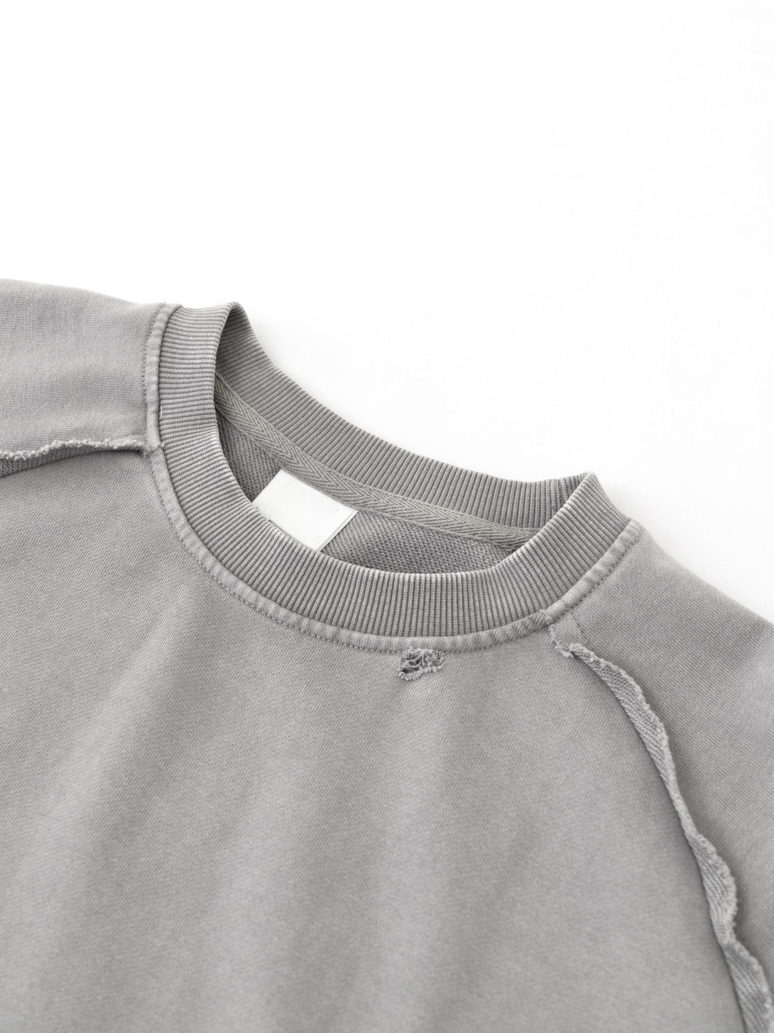 Light gray pigment-dye collar with cracked-print texture - Snow-wash neckline detail for garment manufacturing