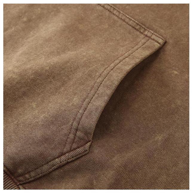 Close-up of the Vintage Wash Hoodie showcasing the pocket detail and durable stitching.
