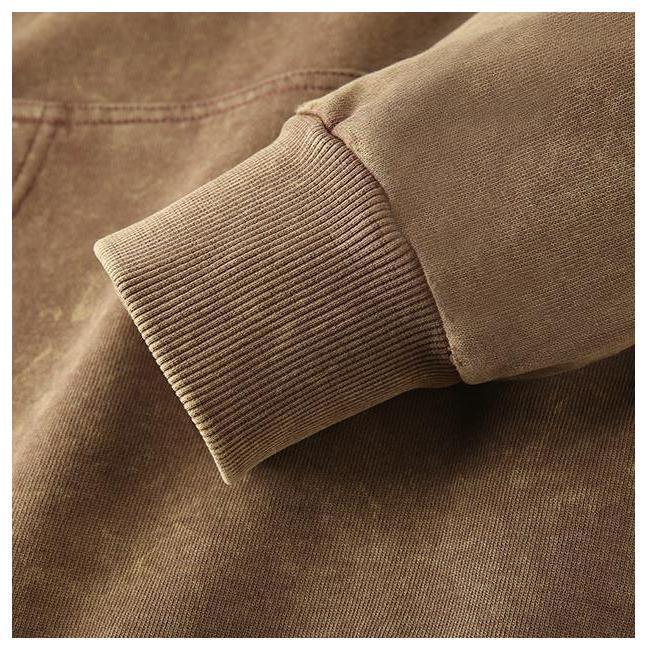 Close-up of Vintage Wash Hoodie showcasing 1x1 ribbed cuff detail on a heavyweight pullover.