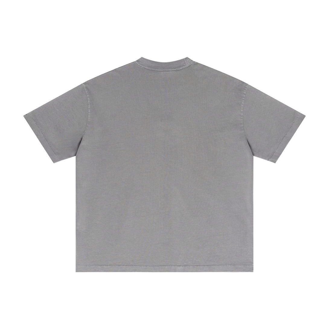 Gray pigment-dyed cotton tee back perspective with vintage wash effect. Bulk oversized distressed apparel.