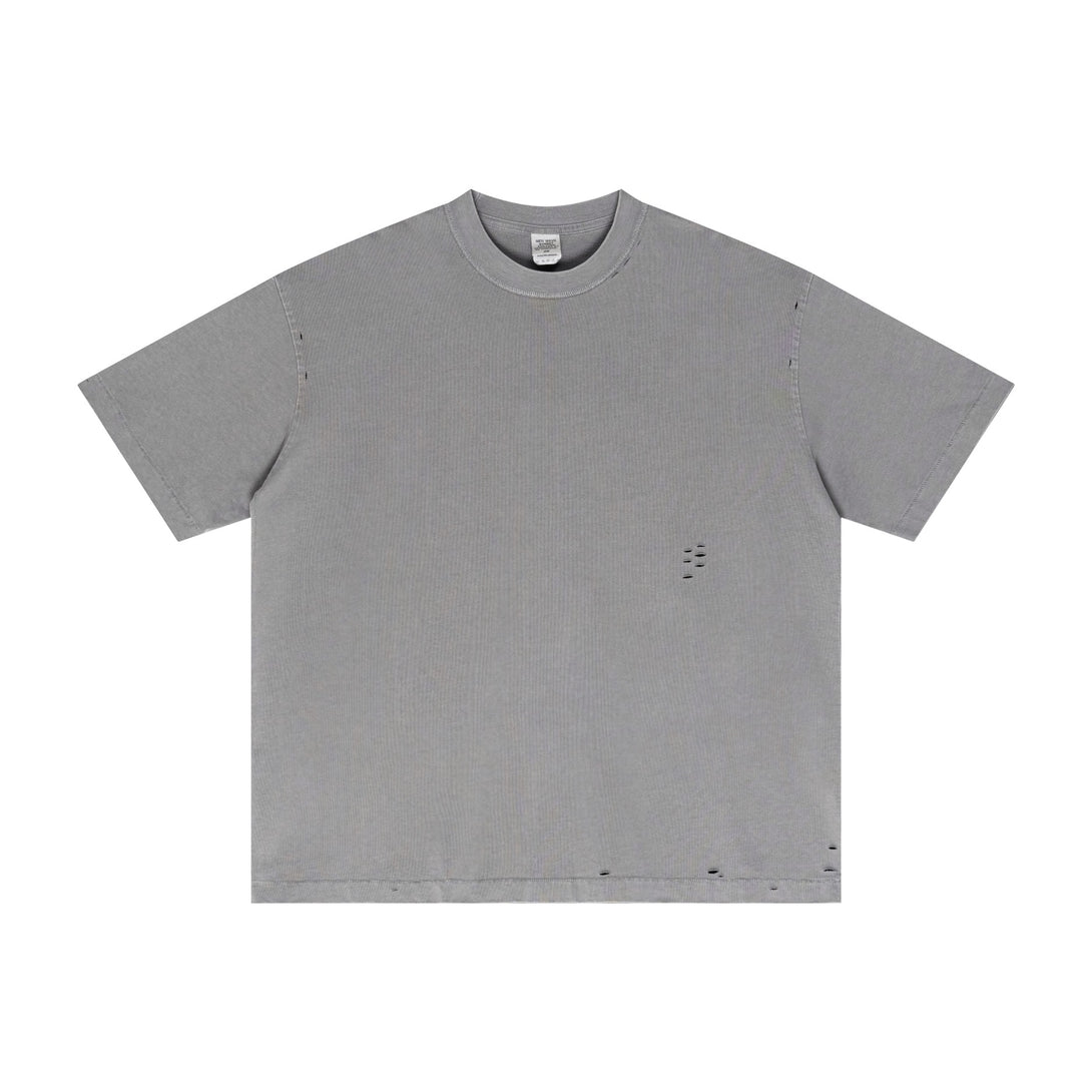 Gray vintage wash cotton t-shirt featuring pigment-dyed texture and oversized fit, front. Distressed streetwear essential for bulk orders.