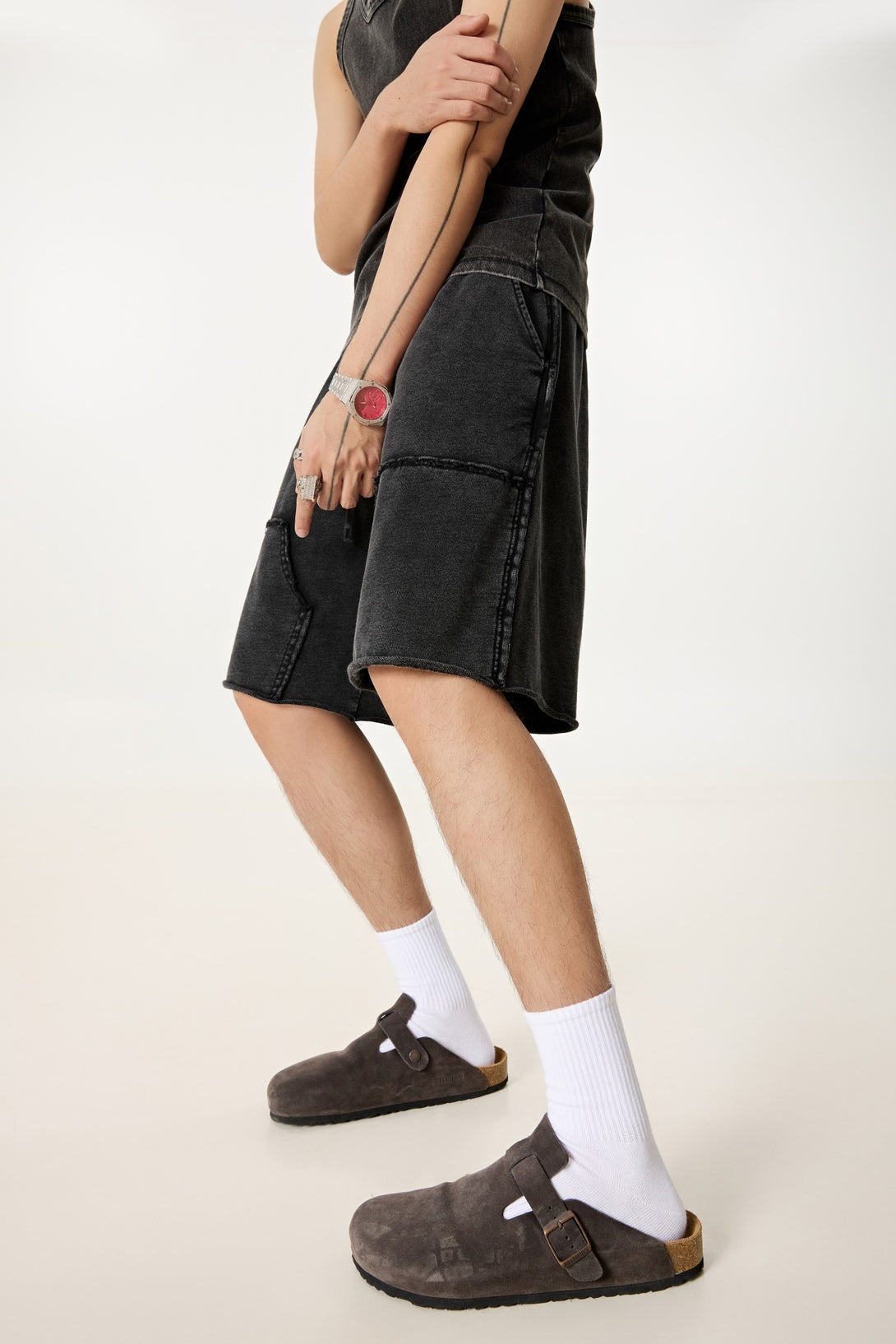 Model wearing men's streetwear wax wash shorts, back view