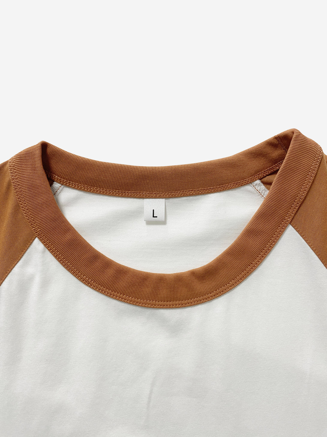 Close-up collar detail of sustainable Sorona blend t-shirt in White/Vintage Orange - wholesale apparel