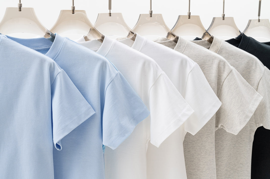 Hanging display of all color women's t-shirts - SS25 collection for wholesale bulk orders