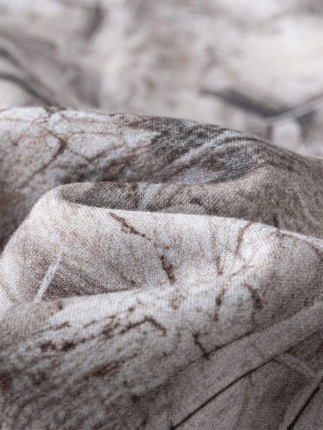 Close-up of the fabric detail used in Men's 340g Woodland Camo Zip Up Hoodie, showcasing the camo print texture.