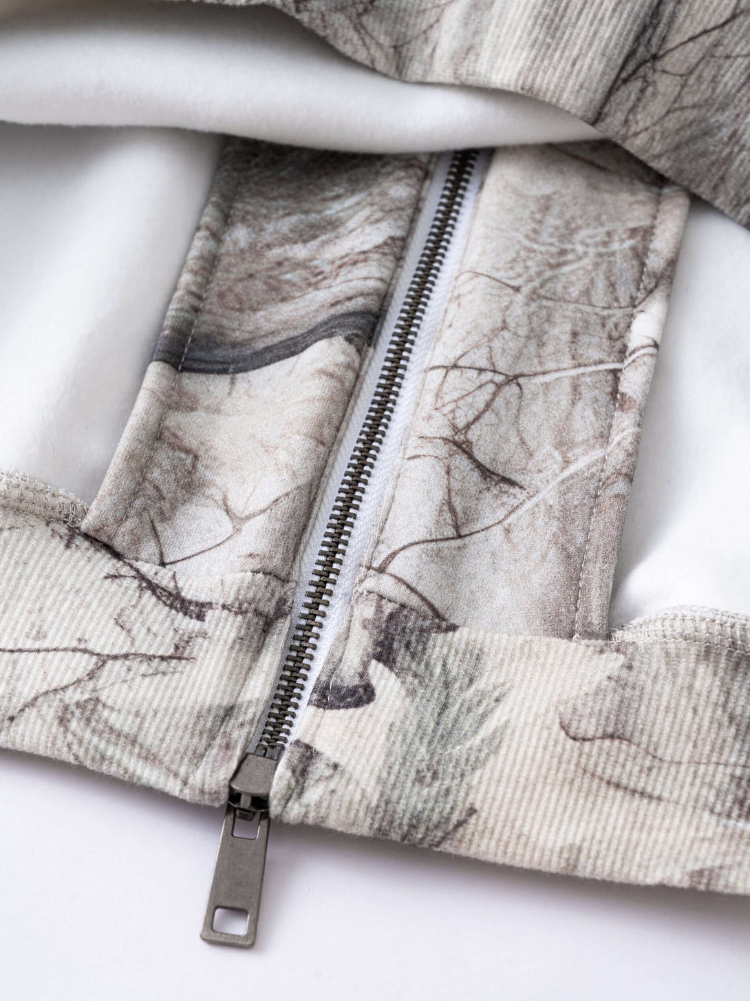 Men's 340g Woodland Camo Zip Up Hoodie zipper detail showcasing high-quality fabric and print.