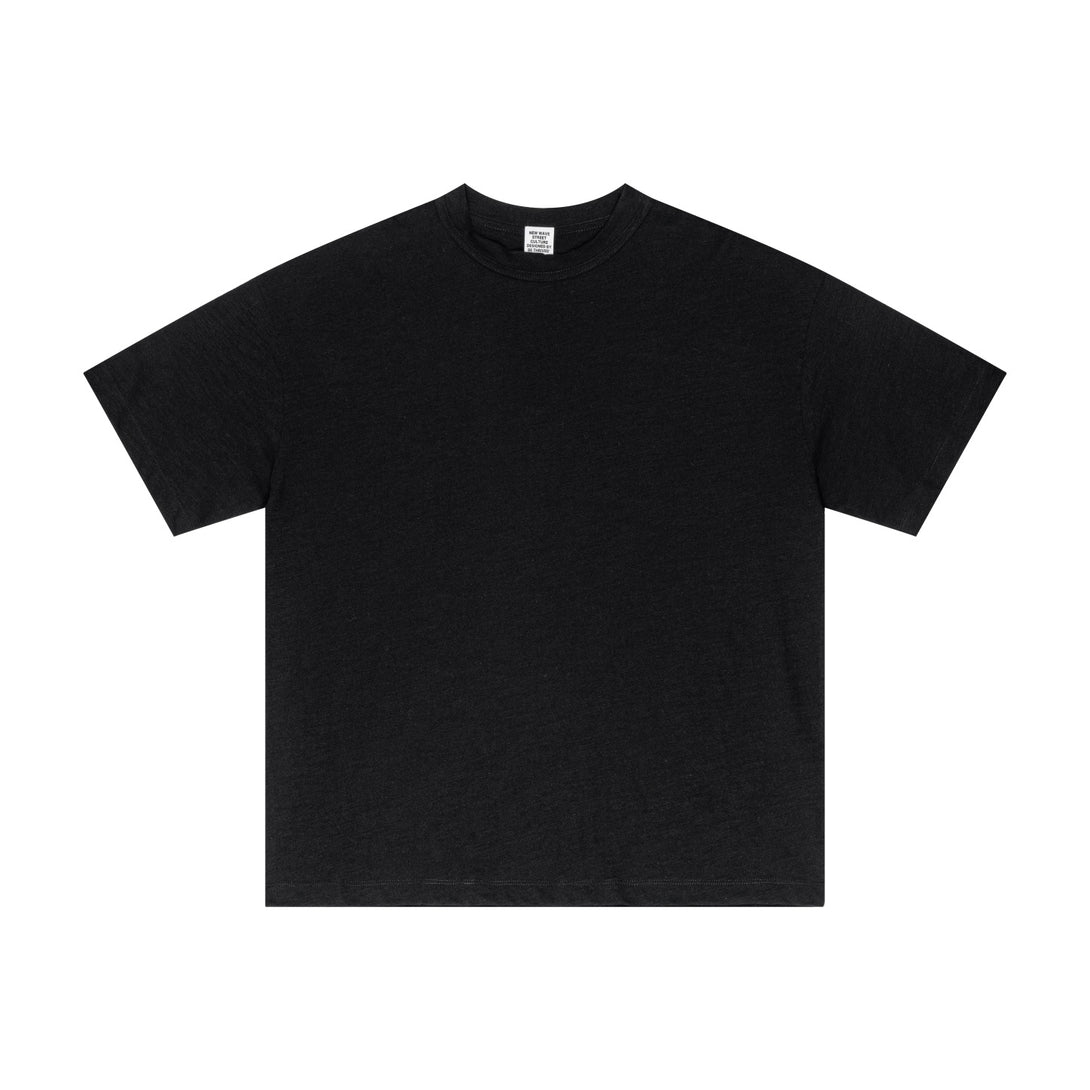 Black yarn-dyed cotton tee front with textured weave, durable fabric for streetwear wholesale.